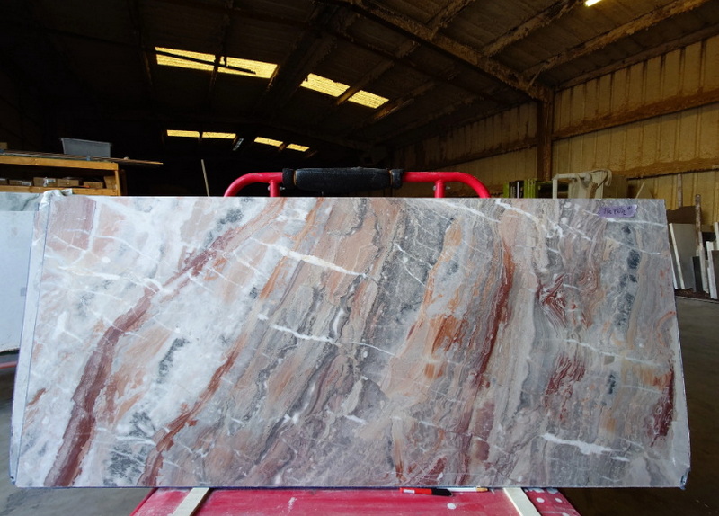 What Are The Red Streaks in Slabs of Marble?